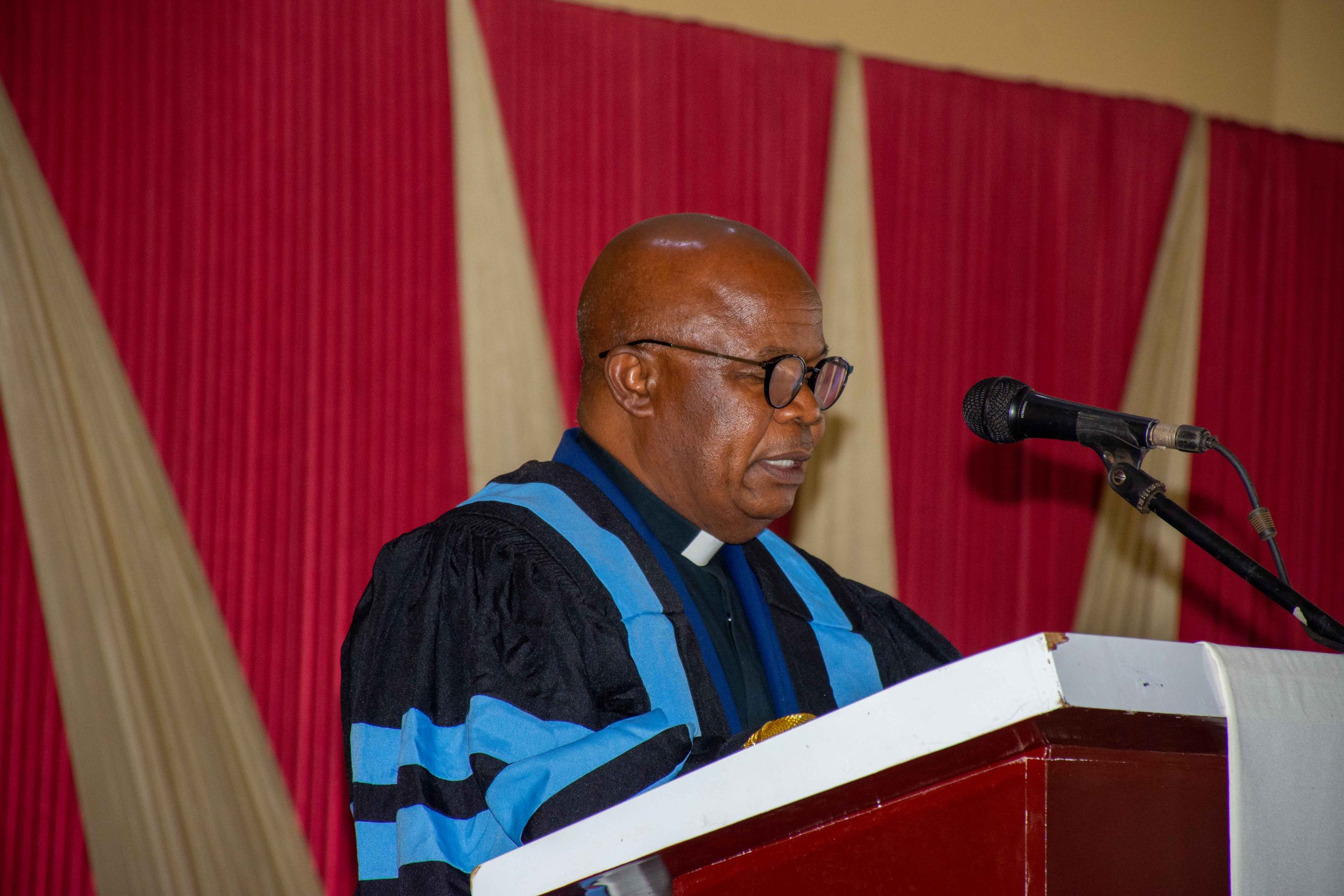 Monsignor Thawale addressing the students and the gathering at Chaminade MSS during Graduation Celebration