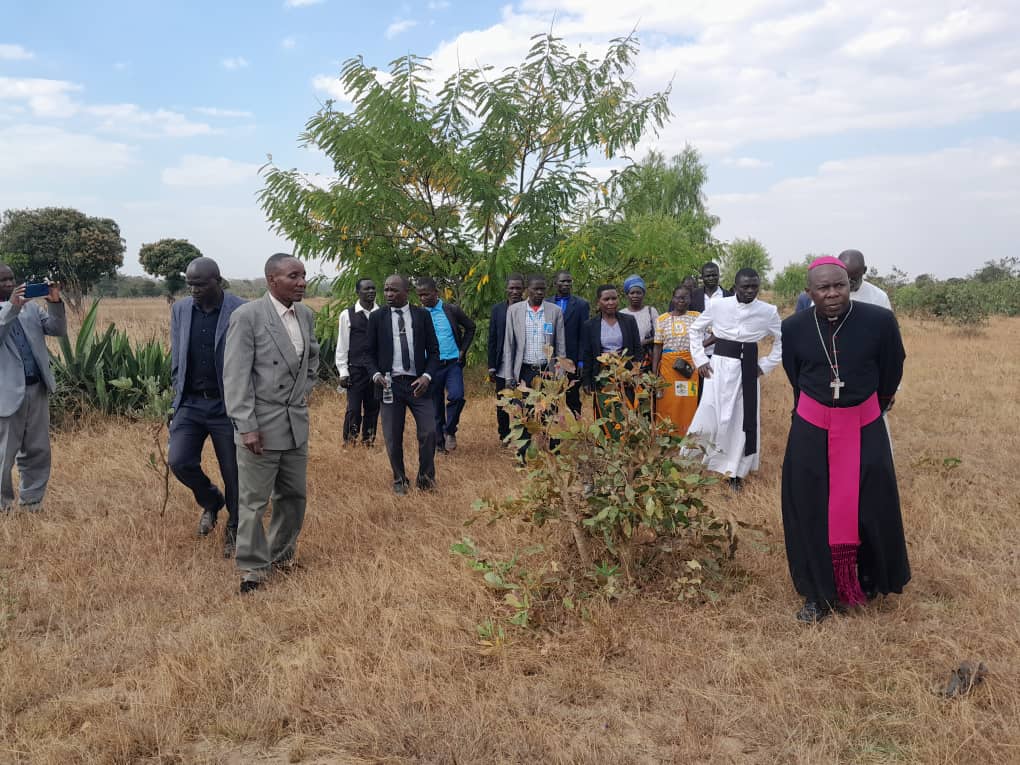 After confirmation, Bishop Mwakhwawa and Kafulama Zone church leaders inspect the land that the church occupies