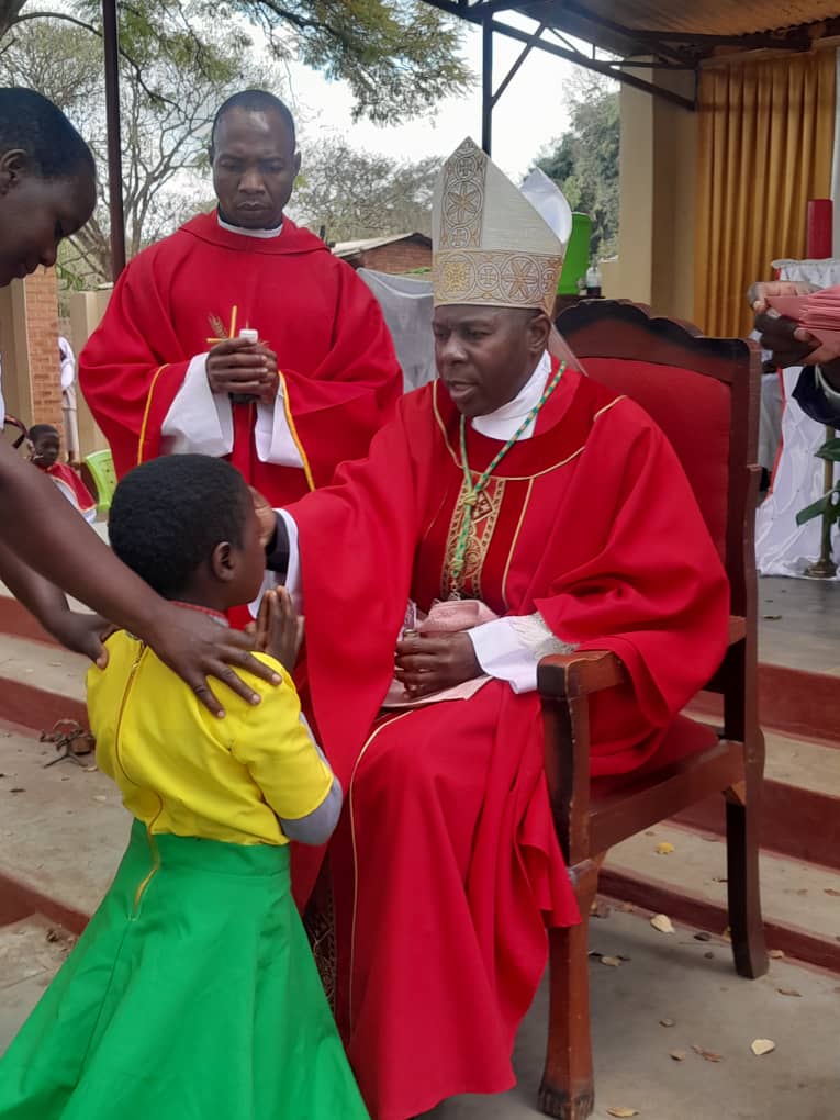 Bishop Mwakhwawa administering the Sacrament of Confirmation at Ludzi Parish