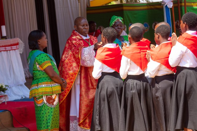 Confirmands receive the sacrament of Eucharist