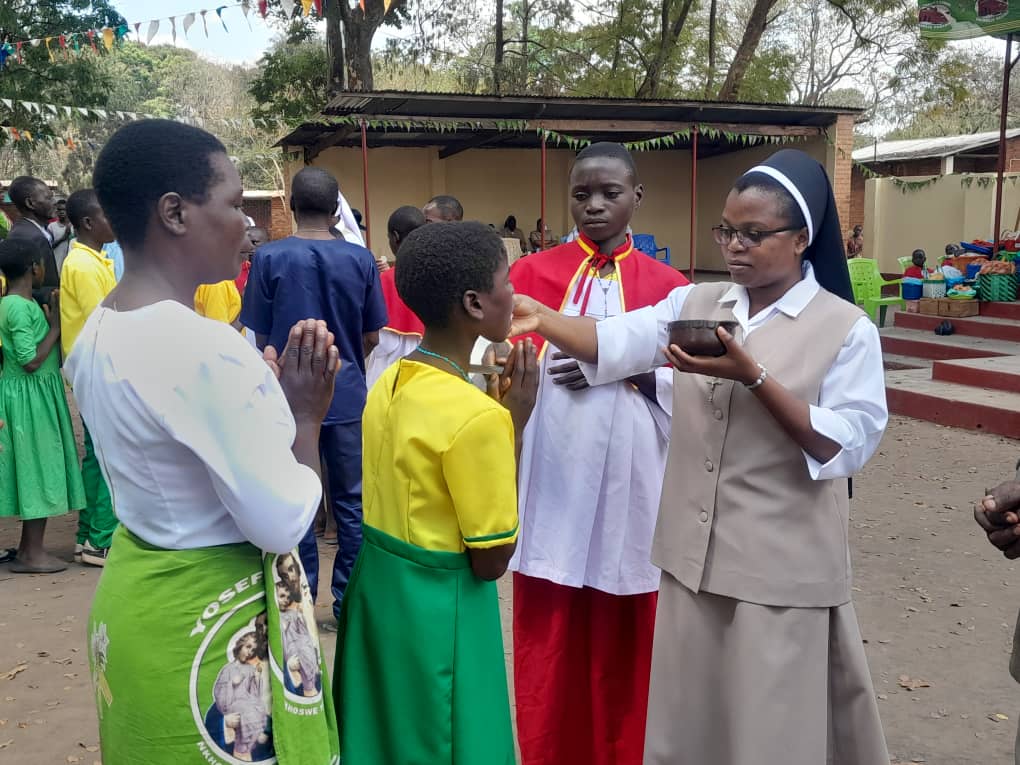 New confirmed adolescents receiving Holy Communion