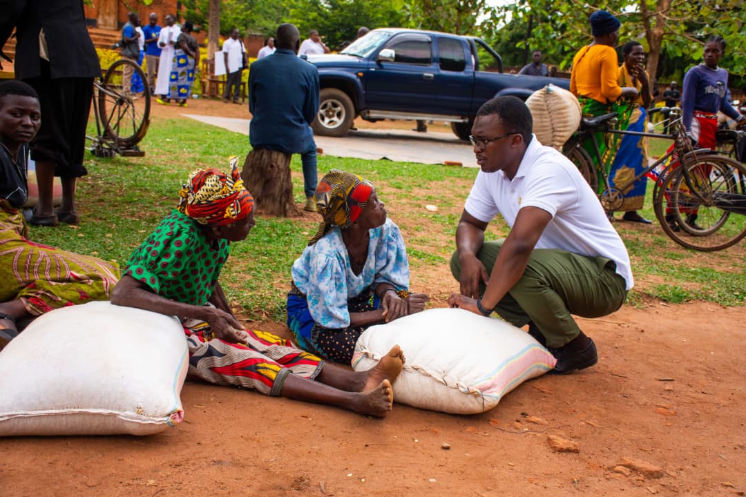 Odiambo interacting with some of the beneficiaries