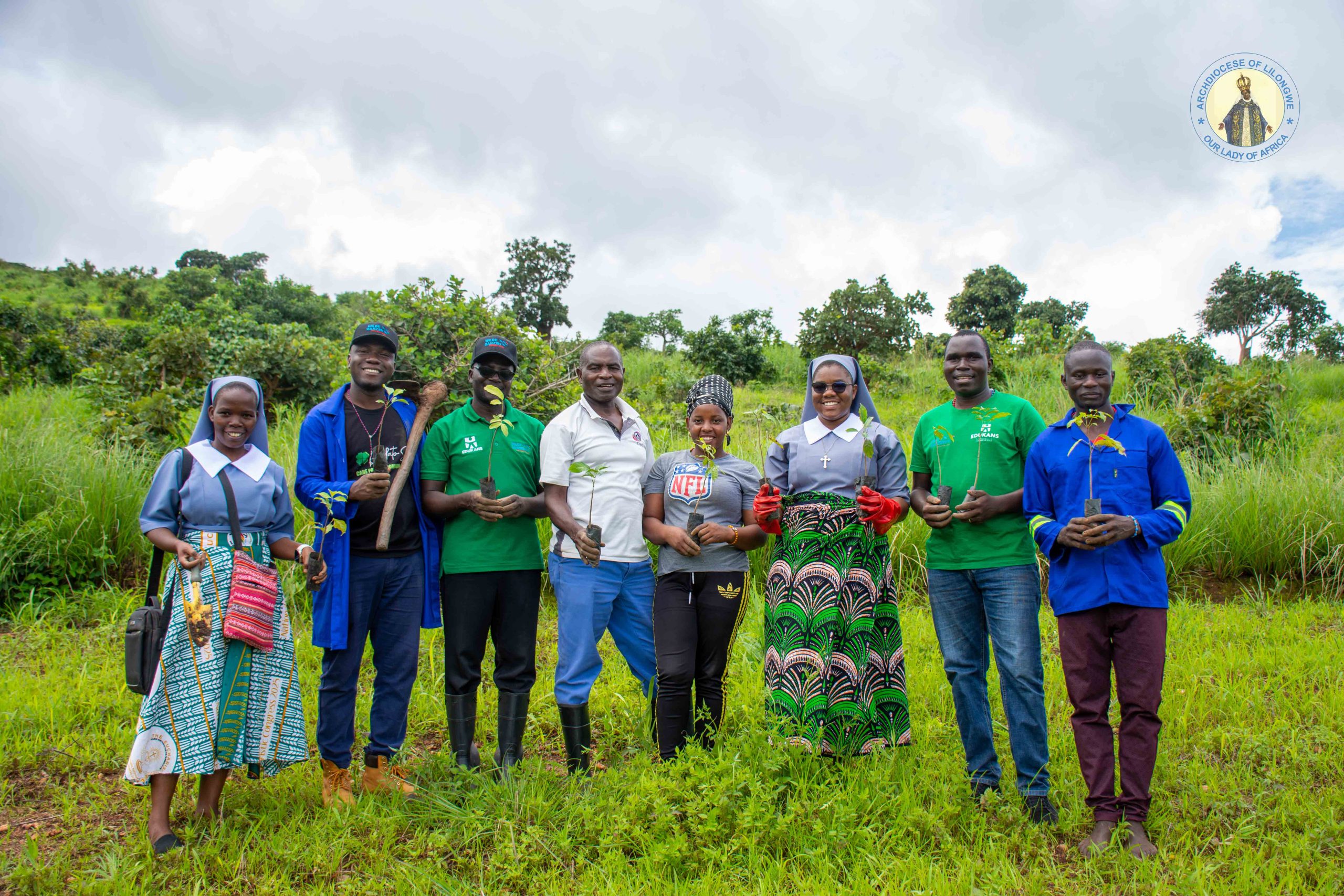 The Archdiocesan Administration representatives showcase the trees before planting at Nanthomba Parish