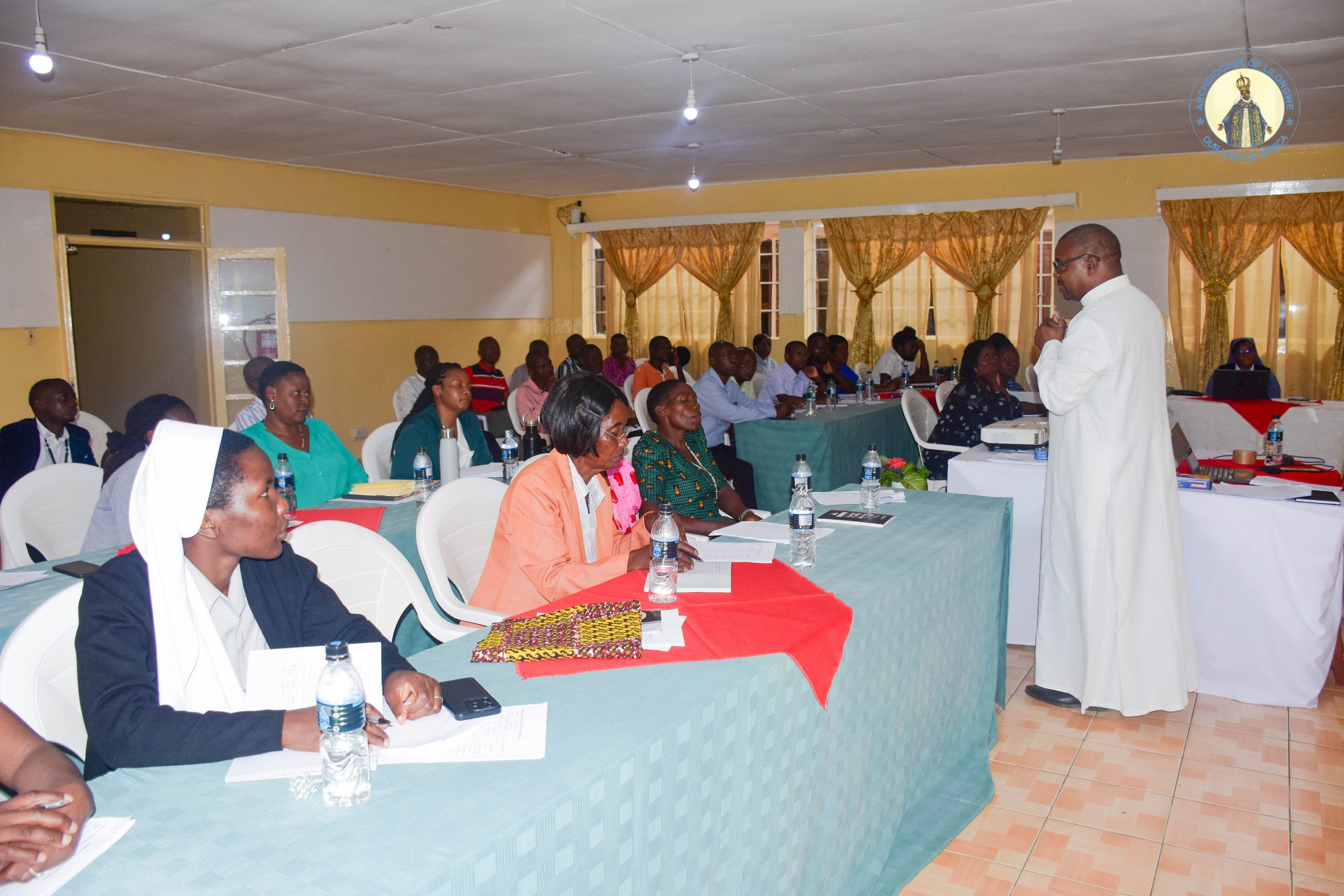 Fr Kubalasa training bookeepers on how to records financial reports